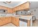 Kitchen features wood cabinets, a dishwasher, and a microwave at 20189 Sw 77Th St, Dunnellon, FL 34431