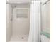 Large shower with a window and a white tile surround at 20189 Sw 77Th St, Dunnellon, FL 34431