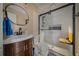 Modern bathroom with walk-in shower and floating vanity at 21654 Sw Honeysuckle St, Dunnellon, FL 34431