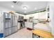 Modern kitchen with stainless steel appliances and granite counters at 21654 Sw Honeysuckle St, Dunnellon, FL 34431