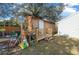 Charming storage shed with wooden deck and railing at 21654 Sw Honeysuckle St, Dunnellon, FL 34431