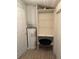 Small laundry area with shelving and water heater at 2211 Sw 1St St, Ocala, FL 34475