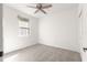 Bright bedroom with ceiling fan and window at 231 Ne 28Th Ave # 204, Ocala, FL 34470