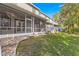 Ground level view of exterior showing multiple screened porches at 231 Ne 28Th Ave # 204, Ocala, FL 34470