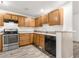 Well-equipped kitchen featuring wood cabinets and modern appliances at 231 Ne 28Th Ave # 204, Ocala, FL 34470