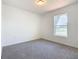 Bright bedroom with window and carpet flooring at 2457 Bulrush Dr, Saint Cloud, FL 34769