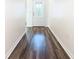 Bright entryway with wood-look floors and white walls at 2457 Bulrush Dr, Saint Cloud, FL 34769