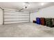 Garage with automatic door opener and extra storage space at 2457 Bulrush Dr, Saint Cloud, FL 34769