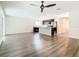 Spacious living area with vinyl plank flooring and sliding doors at 2457 Bulrush Dr, Saint Cloud, FL 34769