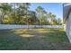 Fenced backyard with a grassy area and mature trees at 3914 Ne 58Th Cir, Silver Springs, FL 34488