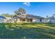 Spacious backyard with a large grassy area and a privacy fence at 3914 Ne 58Th Cir, Silver Springs, FL 34488