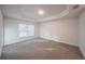 Spacious bedroom with carpeted floor and large window at 3914 Ne 58Th Cir, Silver Springs, FL 34488