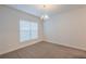 Formal dining room with a chandelier and large window at 3914 Ne 58Th Cir, Silver Springs, FL 34488