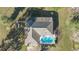 Aerial view of house, pool, and surrounding property at 3996 Se 150Th St, Summerfield, FL 34491