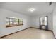 Bedroom with bay window and wood-look floors at 3996 Se 150Th St, Summerfield, FL 34491