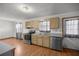 Simple kitchen with light wood cabinets and stainless steel appliances at 3996 Se 150Th St, Summerfield, FL 34491