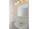 Clean bathroom with a single sink vanity and mirror at 4098 Sw 51 St, Ocala, FL 34474