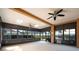 Spacious sunroom with ceiling fans and multiple windows at 4098 Sw 51 St, Ocala, FL 34474