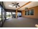 Bright sunroom with two ceiling fans and windows at 4098 Sw 51 St, Ocala, FL 34474