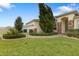 House exterior with landscaping, paver driveway, and two-car garage at 4314 Sw 65Th Pl, Ocala, FL 34474