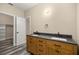 Bathroom with double vanity and dark countertop at 4377 Ne 13Th St, Ocala, FL 34470