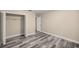 Bedroom with spacious closet and wood-look floors at 4377 Ne 13Th St, Ocala, FL 34470