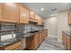 Modern kitchen featuring granite countertops and light wood cabinets at 4377 Ne 13Th St, Ocala, FL 34470