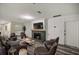 Modern living room featuring a stone fireplace and comfortable seating at 4377 Ne 13Th St, Ocala, FL 34470