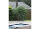 Inviting backyard with lush landscaping and a refreshing pool at 4434 Se 10Th Pl, Ocala, FL 34471