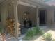 Front porch with a stacked wood and decorative elements at 4434 Se 10Th Pl, Ocala, FL 34471