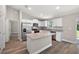 Modern kitchen with stainless steel appliances and granite countertops at 46 Locust Pass Run, Ocala, FL 34480