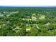 An aerial view showing the home's location in a lush, green neighborhood at 4977 Se 44Th Cir, Ocala, FL 34480