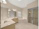 Bathroom includes a large soaking tub, walk-in shower, and double vanity at 4977 Se 44Th Cir, Ocala, FL 34480