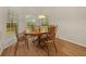 Cozy breakfast nook with wood table and chairs, bathed in natural light at 4977 Se 44Th Cir, Ocala, FL 34480