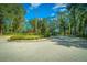 Dayton Woods community entrance with a stately gate and landscaping at 4977 Se 44Th Cir, Ocala, FL 34480