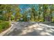 Welcoming entrance to Dayton Woods, featuring a stone and wrought-iron gate at 4977 Se 44Th Cir, Ocala, FL 34480