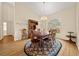 Formal dining room with hardwood floors, chandelier, and large window at 4977 Se 44Th Cir, Ocala, FL 34480