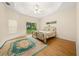 Main bedroom features a ceiling fan and sliding glass doors to the patio at 4977 Se 44Th Cir, Ocala, FL 34480