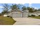 Attractive two-car garage and stone facade at 5053 Se 89Th St, Ocala, FL 34480