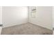 Spacious bedroom with a window and carpet flooring at 5325 Sunshine Dr, Wildwood, FL 34785