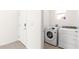 Laundry room with washer, dryer, and exterior access at 5325 Sunshine Dr, Wildwood, FL 34785