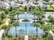 Aerial view of community pickleball courts surrounded by palm trees at 5325 Sunshine Dr, Wildwood, FL 34785