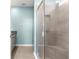 Large walk-in shower with built-in seat and glass enclosure at 5325 Sunshine Dr, Wildwood, FL 34785