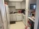 Small kitchen with white cabinets and appliances at 533 Midway Dr # B, Ocala, FL 34472