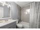 Clean bathroom with a bathtub, shower, and updated vanity at 536 Ne 43Rd Ave, Ocala, FL 34470