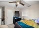 Well-lit bedroom with a dresser and ceiling fan at 536 Ne 43Rd Ave, Ocala, FL 34470