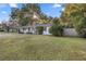 Ranch style home with a large front yard and wooden fence at 536 Ne 43Rd Ave, Ocala, FL 34470