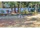 Fenced backyard with a dog and landscaping at 5579 Se 44Th Cir, Ocala, FL 34480