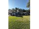 House exterior showcasing a well-maintained lawn and a two-car garage at 5579 Se 44Th Cir, Ocala, FL 34480