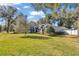 House with a large front yard and landscaping at 5579 Se 44Th Cir, Ocala, FL 34480